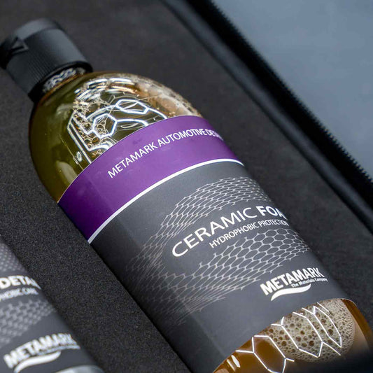 Bottle of Metamark Ceramic Foam on a car interior background